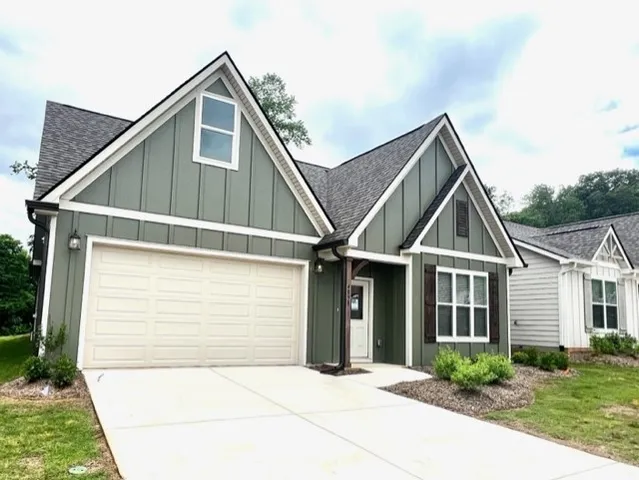 a front view of a house with garage