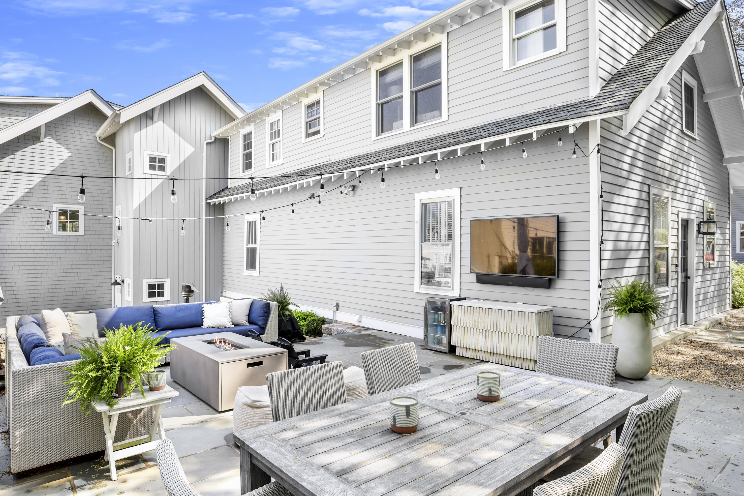 78 Roton Avenue Norwalk, CT 06853 - Photo 25 of 31 a view of a patio with couches table and chairs with potted plants