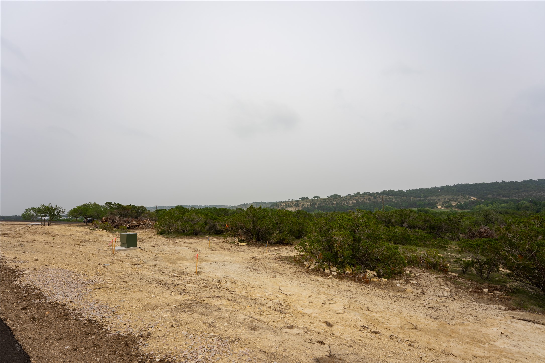 Lot 2 Ranch Road 165 Dripping Springs, TX 78620 - Photo 9 of 13 Expansive land parcel featuring existing utility infrastructure and natural vegetation