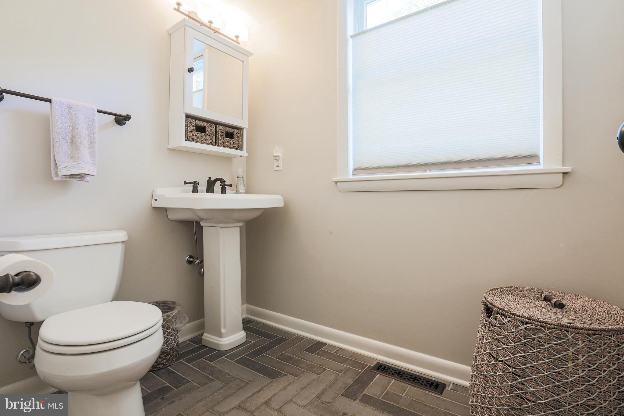 2518 Jonathan Road Ellicott City, MD 21042 - Photo 35 of 52 Half Bath off of Family room with new tile floors