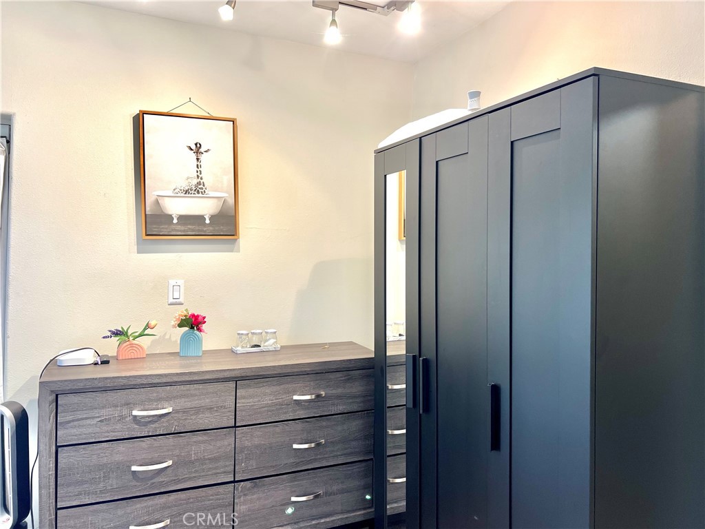 17401 Raymer Street Northridge, CA 91325 - Photo 11 of 19 a bathroom with a shower vanity and a mirror