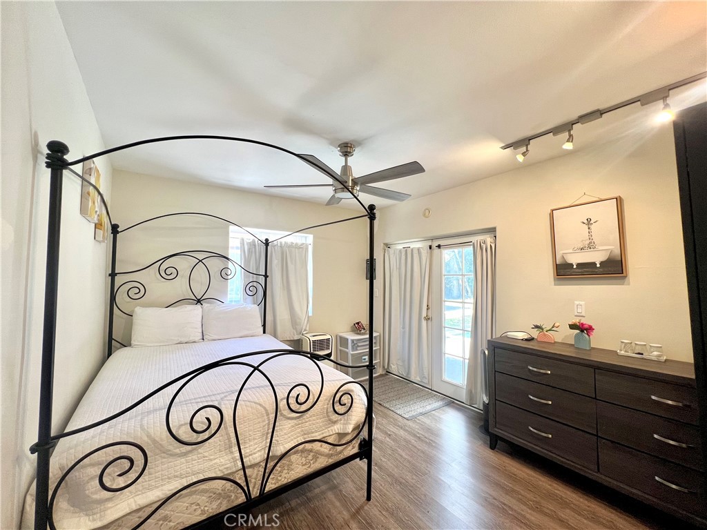 17401 Raymer Street Northridge, CA 91325 - Photo 9 of 19 a bedroom with a bed and a mirror on the dresser