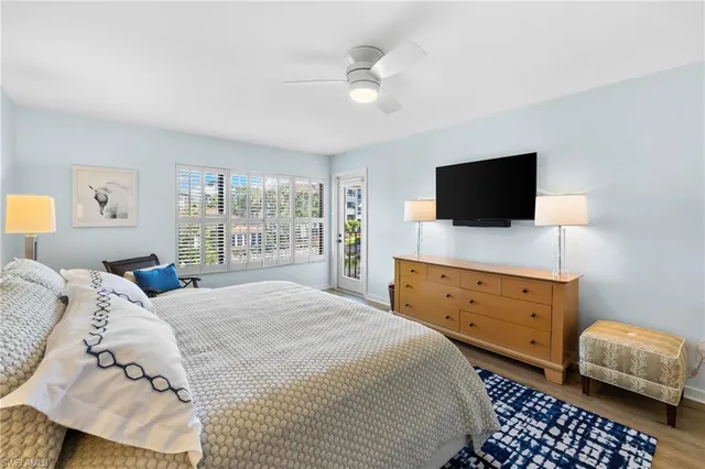 a spacious bedroom with a bed and a table