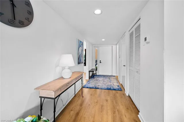 a bathroom with a tub a sink and a large mirror