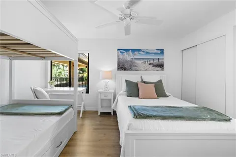 a bedroom with a large bed and a couch