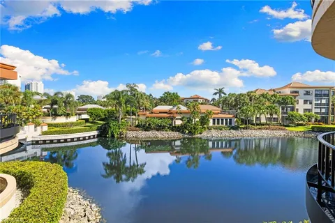 a view of a lake with a large building
