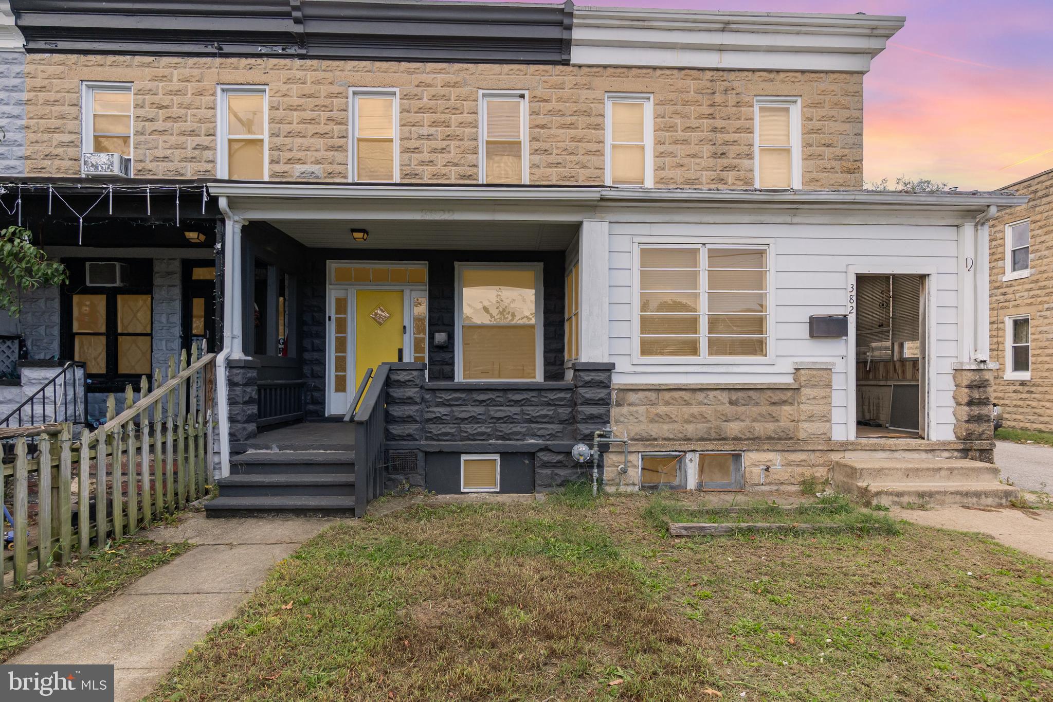 3822 6th Street Baltimore, MD 21225 - Photo 1 of 26 a front view of a house with a garden