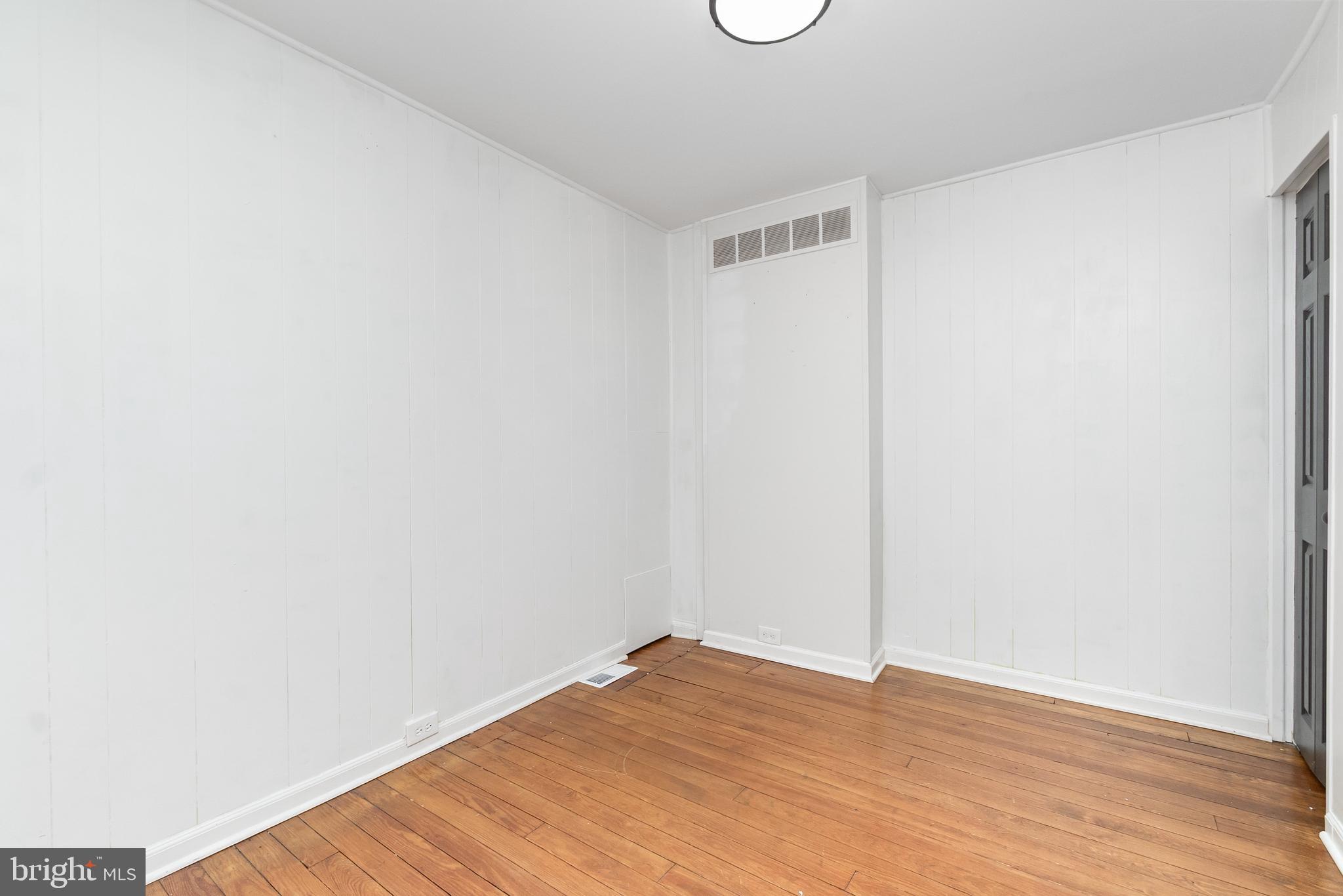 3822 6th Street Baltimore, MD 21225 - Photo 15 of 26 a view of an empty room with wooden floor