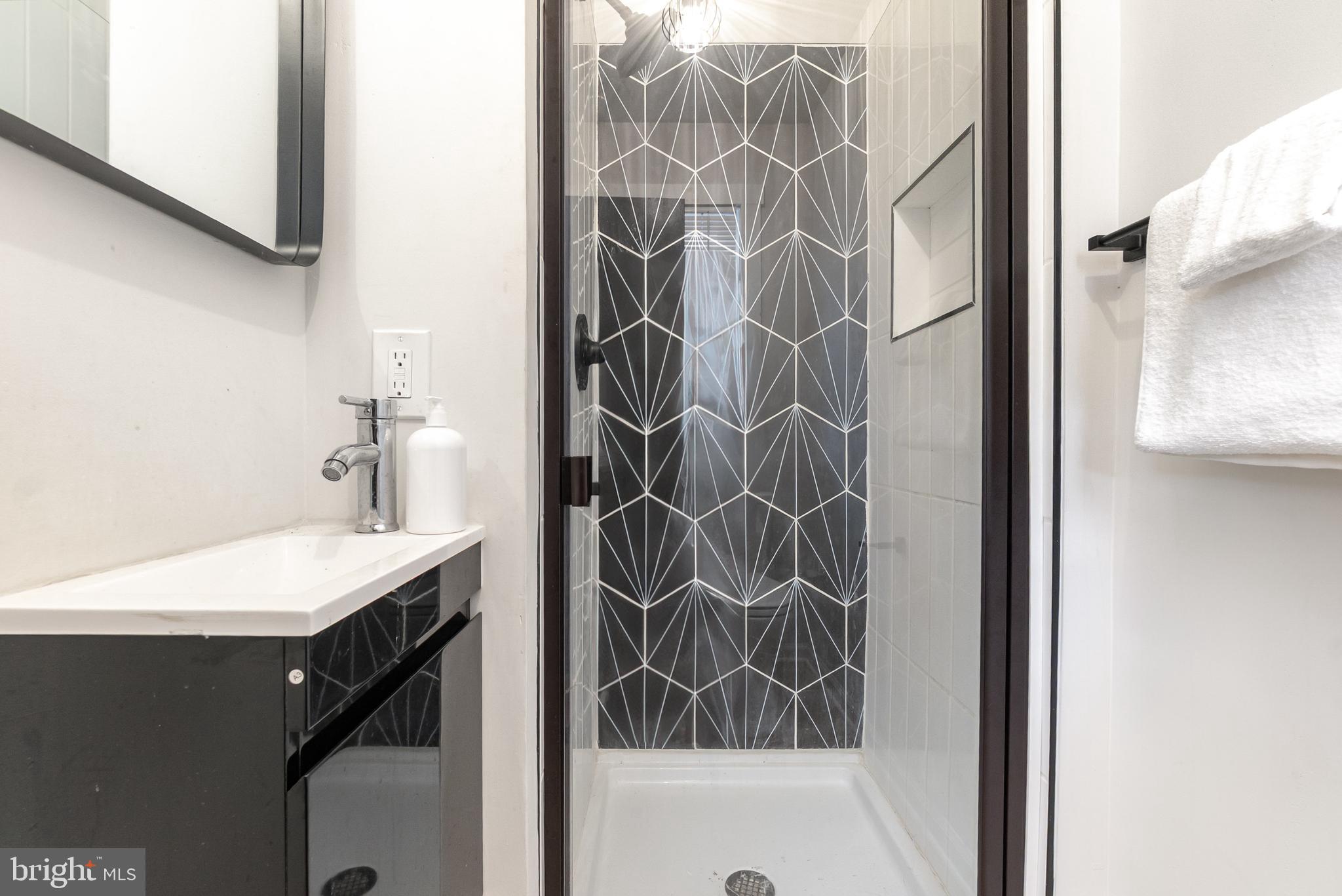 3822 6th Street Baltimore, MD 21225 - Photo 17 of 26 a bathroom with a bathtub and a sink