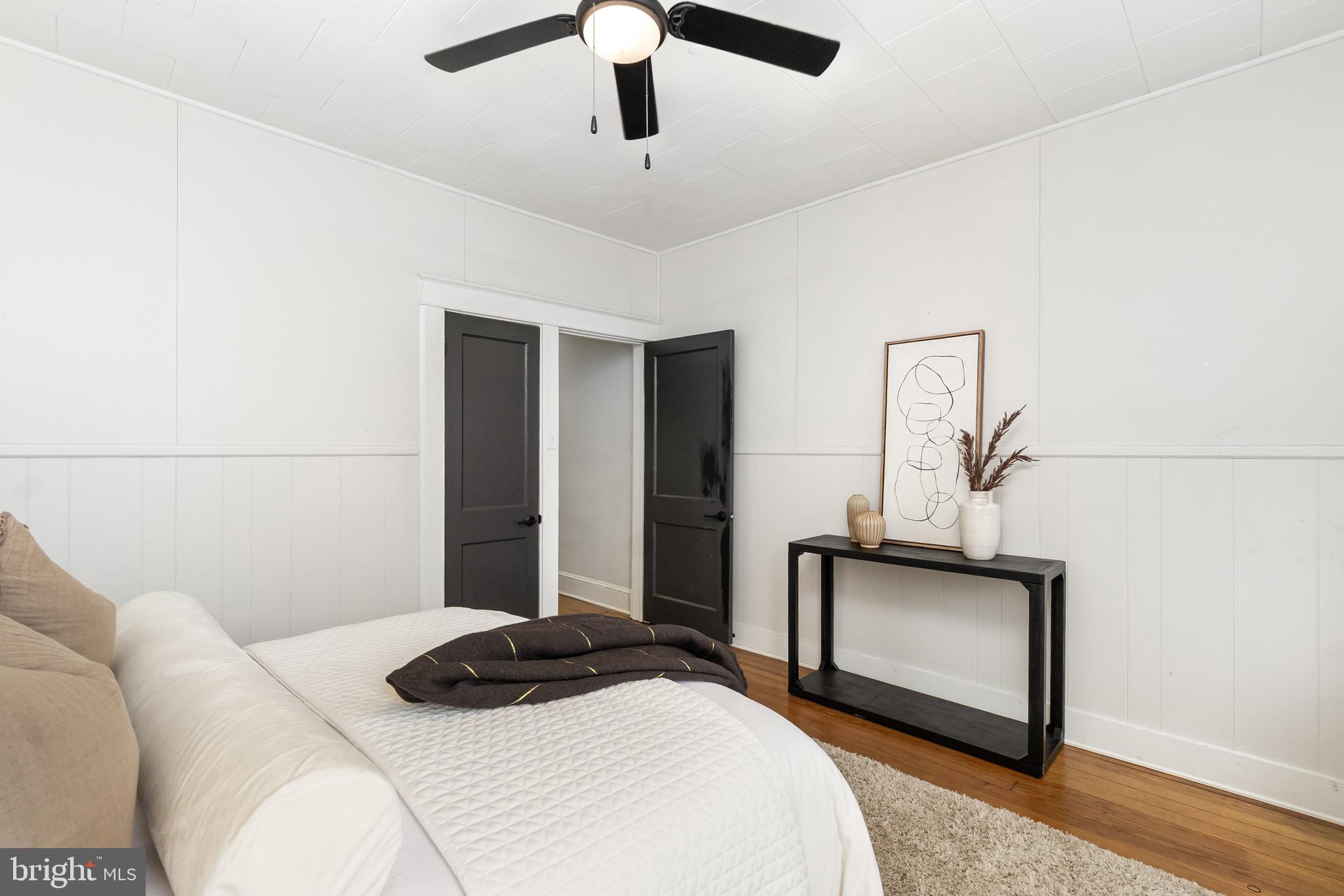 3822 6th Street Baltimore, MD 21225 - Photo 20 of 26 a bedroom with a bed and a television