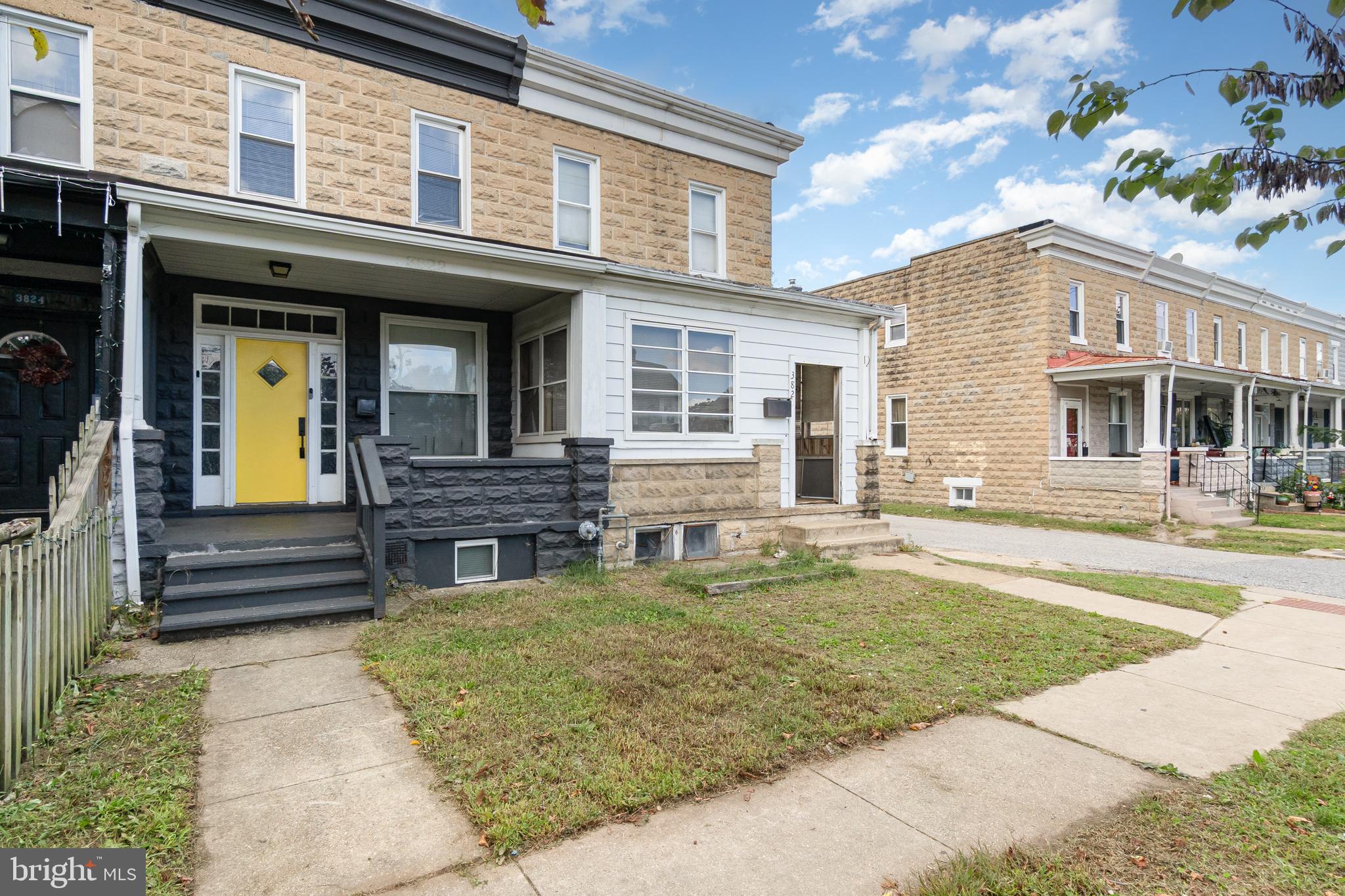 3822 6th Street Baltimore, MD 21225 - Photo 2 of 26 a view of a house with a large window and a fire pit