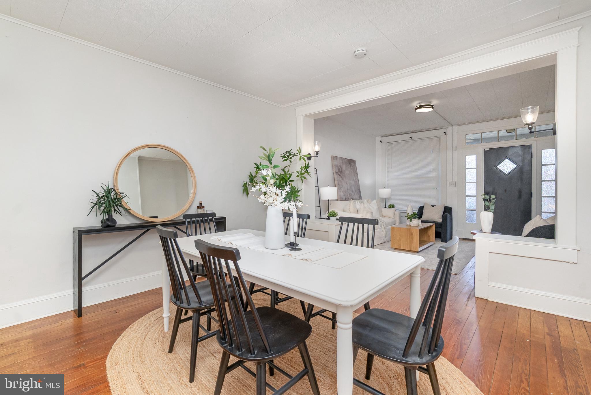 3822 6th Street Baltimore, MD 21225 - Photo 6 of 26 a view of a dining room with furniture and wooden floor