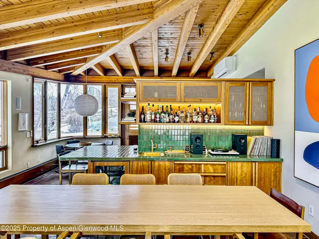 a bedroom with a bed and a fireplace