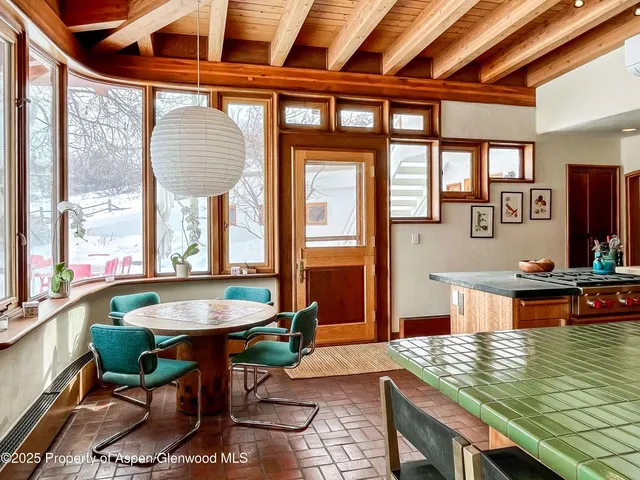 a bedroom with bed and a large window