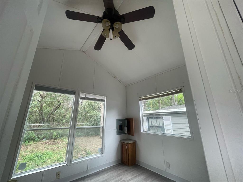 3000 Clarcona Road, Unit 830 Apopka, FL 32703 - Photo 18 of 31 a view of a livingroom with a ceiling fan and window
