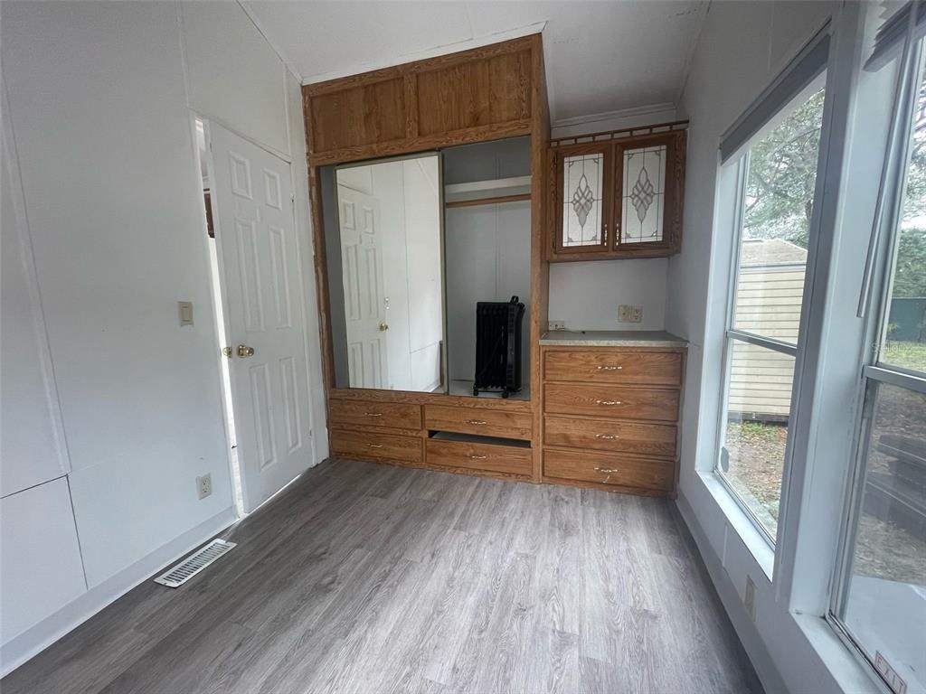 3000 Clarcona Road, Unit 830 Apopka, FL 32703 - Photo 19 of 31 a view of room with window and wooden floor