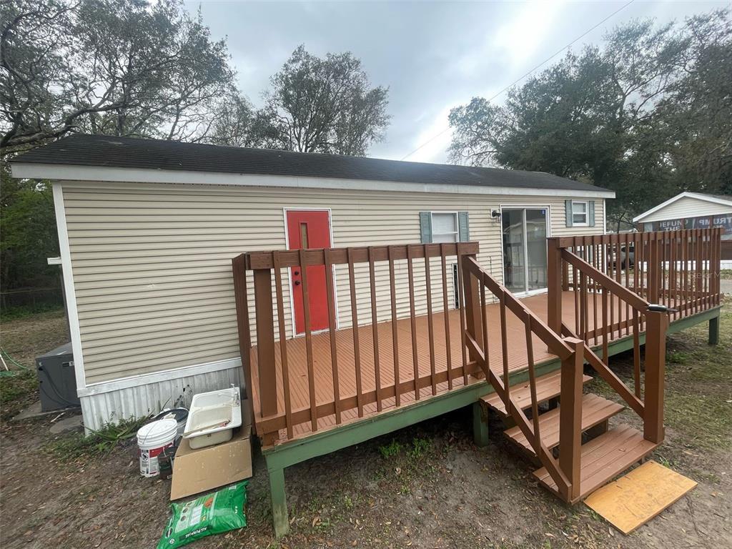 3000 Clarcona Road, Unit 830 Apopka, FL 32703 - Photo 2 of 31 a view of a house with backyard and deck
