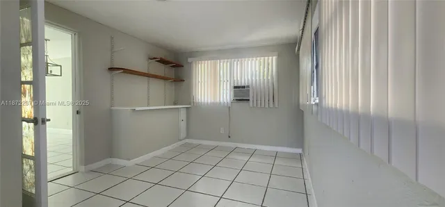 a view of an empty room and window