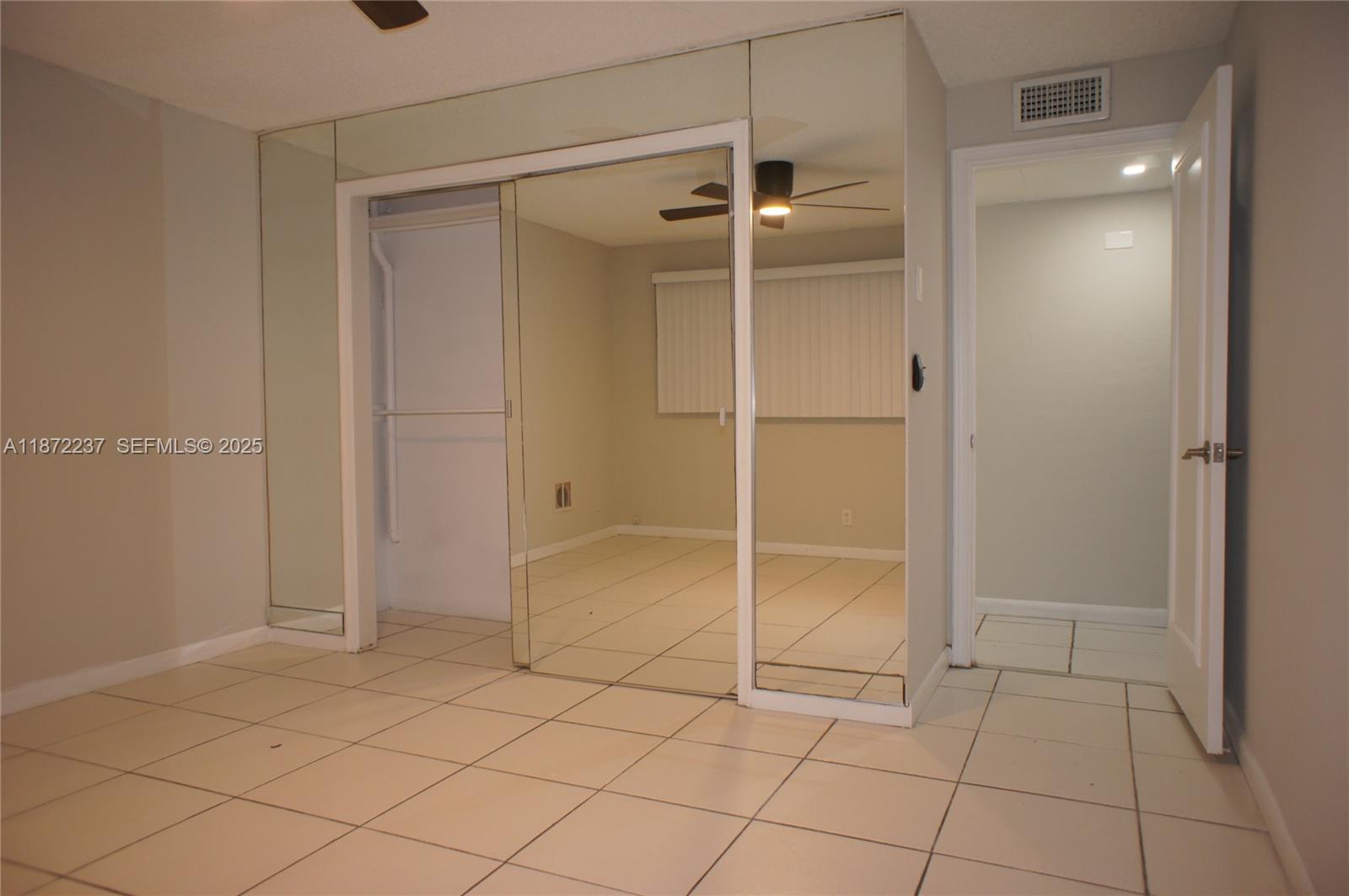 1940 Northeast 31st Court, Unit SOUTH Lighthouse Point, FL 33064 - Photo 39 of 45 a bathroom with a shower and a glass door