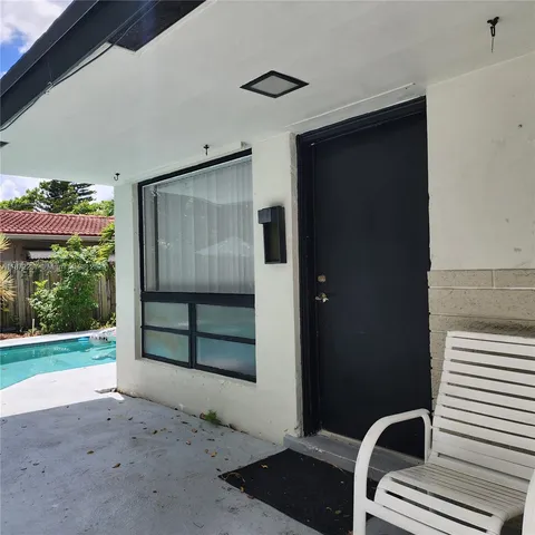 a front view of a house with a large window