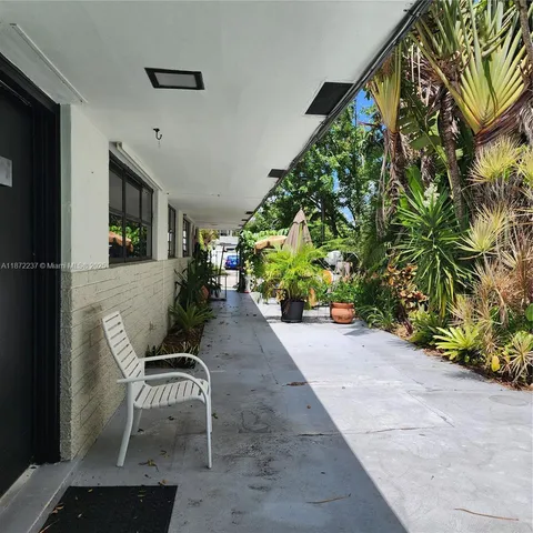 a outdoor space with lots of potted plants