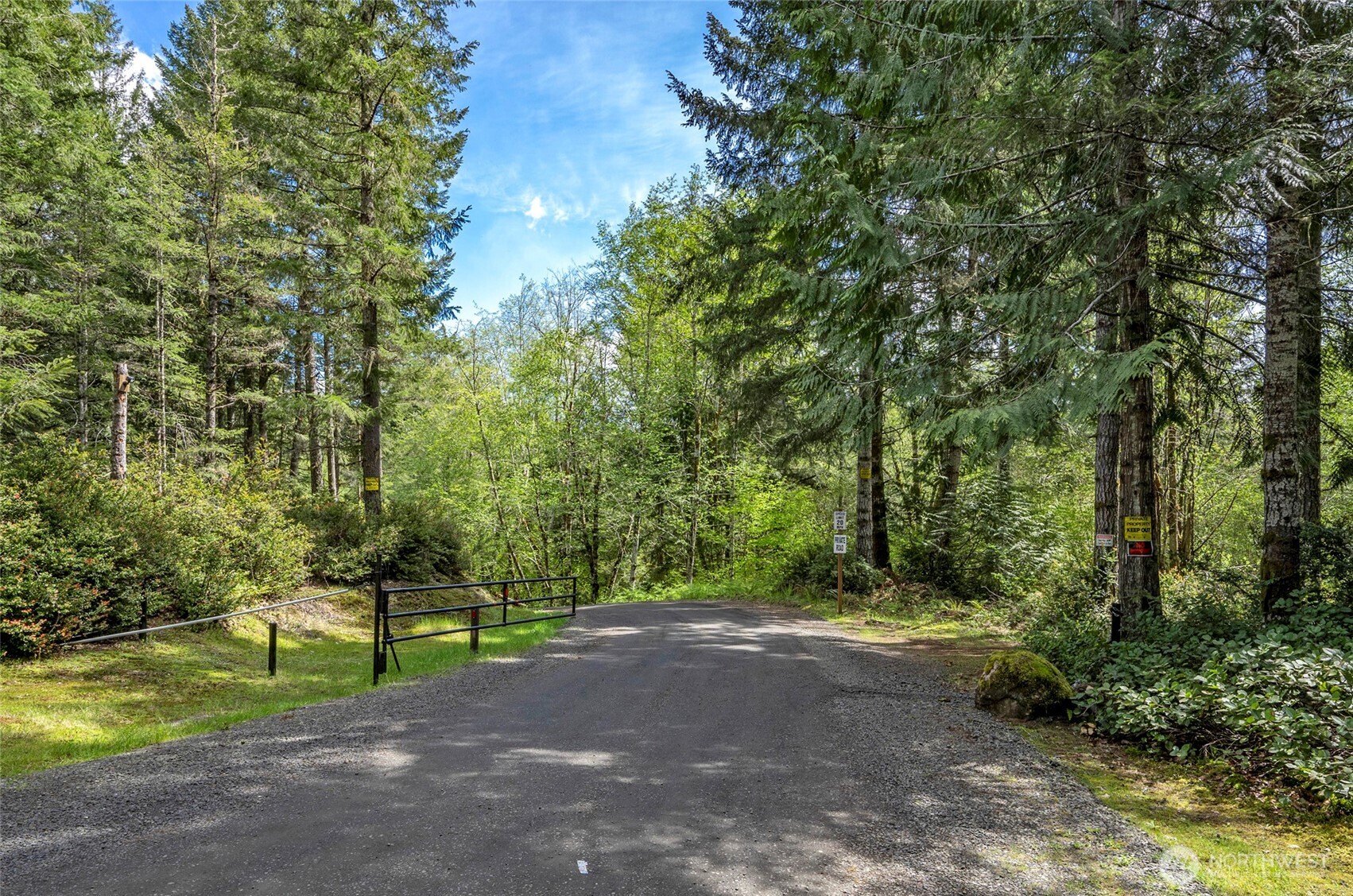 770 East April Avenue Grapeview, WA 98546 - Photo 5 of 16 a view of a road with a trees