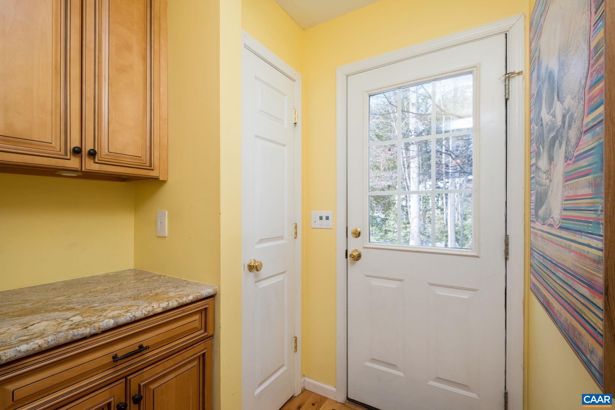 237 Spring Haven Lane Ruckersville, VA 22968 - Photo 13 of 41 a view of a kitchen with wooden floor and windows
