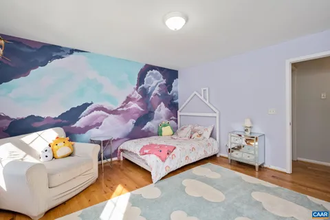 a bedroom with bed and window