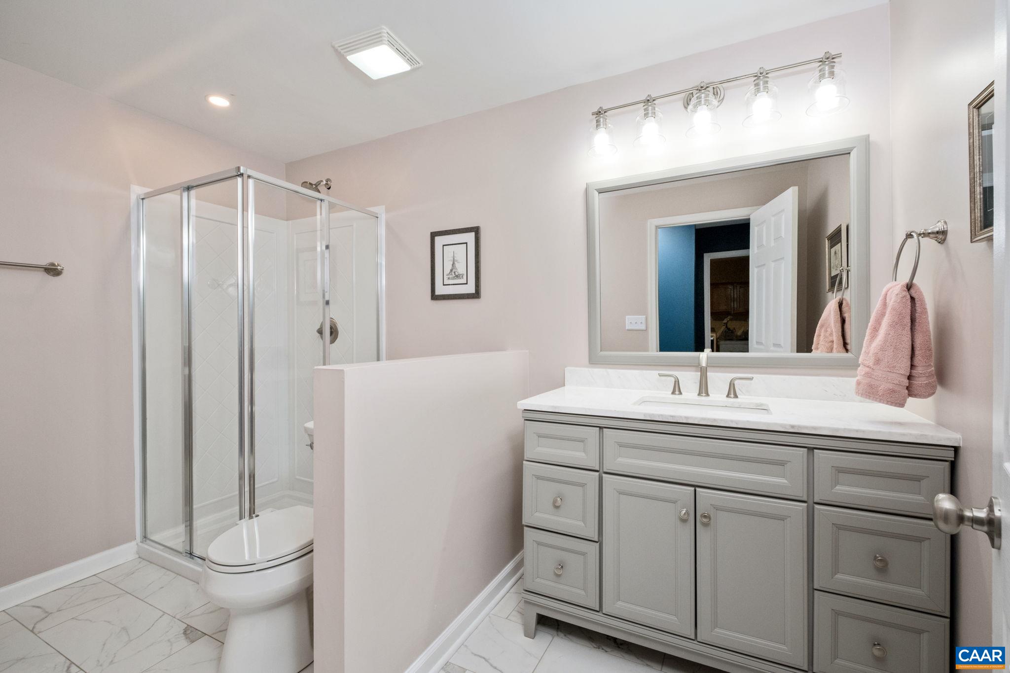 237 Spring Haven Lane Ruckersville, VA 22968 - Photo 30 of 41 a bathroom with a toilet sink and mirror