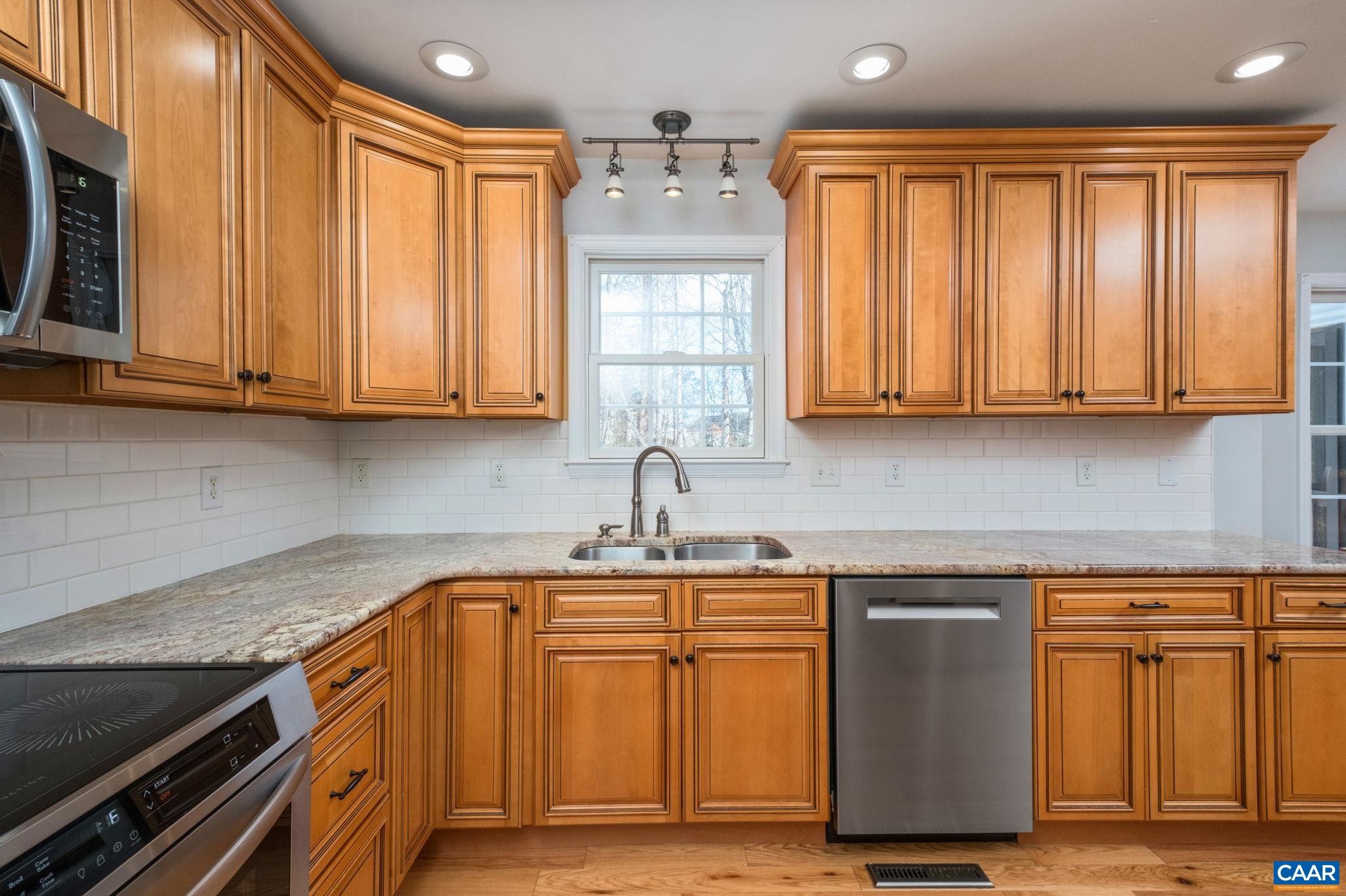 237 Spring Haven Lane Ruckersville, VA 22968 - Photo 3 of 41 a kitchen with stainless steel appliances granite countertop a sink and cabinets