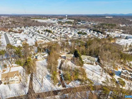 an aerial view of residential building with parking