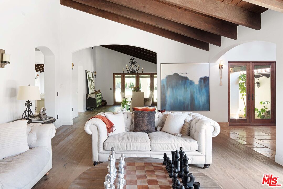 2251 Cold Canyon Road Calabasas, CA 91302 - Photo 8 of 47 a living room with furniture and wooden floor