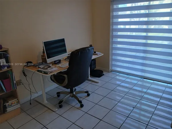 a view of a workspace with furniture