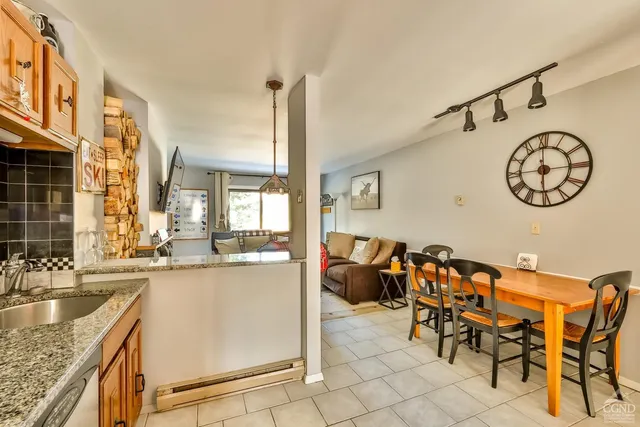 a view of a kitchen with furniture and a window