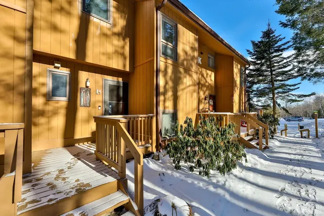 a view of balcony with wooden floor