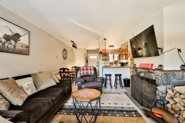 a living room with furniture and a flat screen tv
