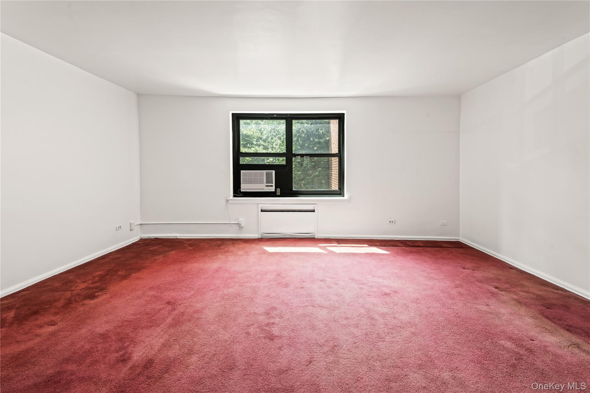 73-45 210th Street, Unit 3F Queens, NY 11364 - Photo 6 of 15 an empty room with a window