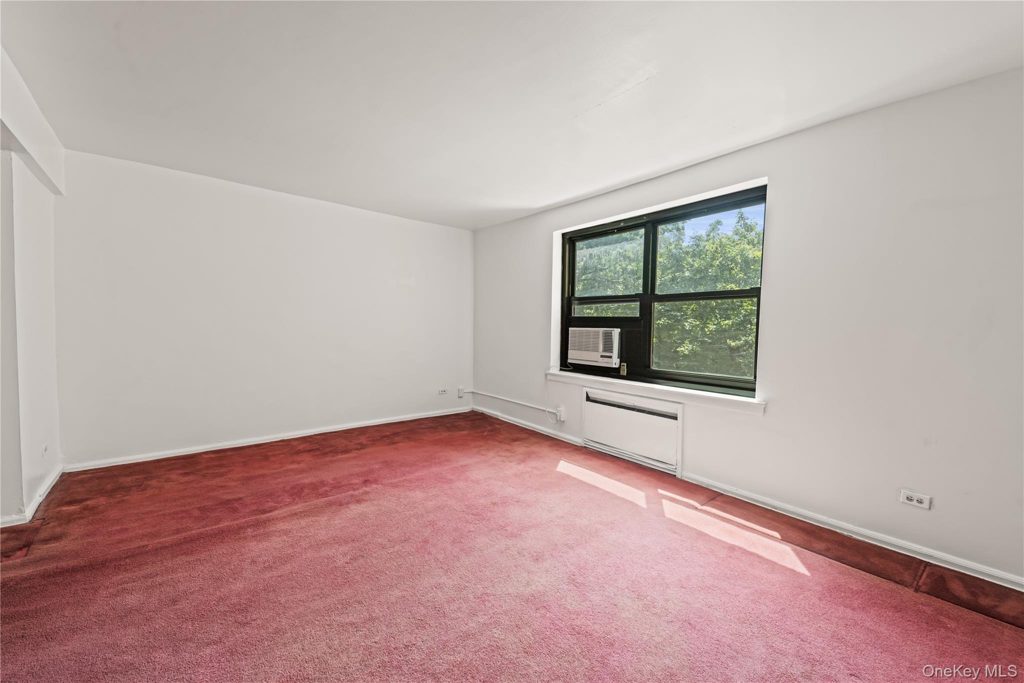 73-45 210th Street, Unit 3F Queens, NY 11364 - Photo 8 of 15 an empty room with a window