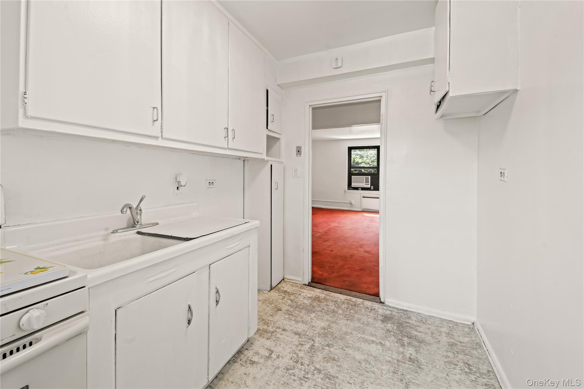 73-45 210th Street, Unit 3F Queens, NY 11364 - Photo 10 of 15 a utility room with cabinets