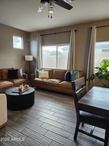a view of a dining room with furniture and chandelier