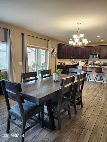 a bathroom with a granite countertop toilet sink and mirror