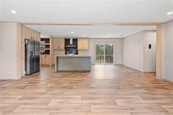 a view of a kitchen with a sink and microwave