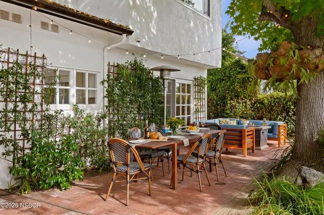 a view of balcony with wooden floor and fence