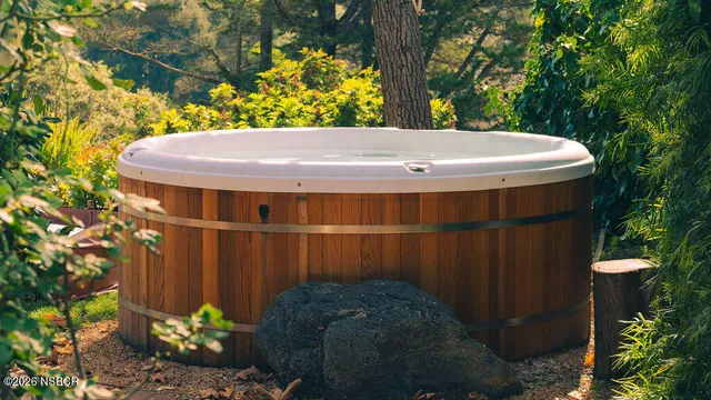 a bed room with a bed and a chair