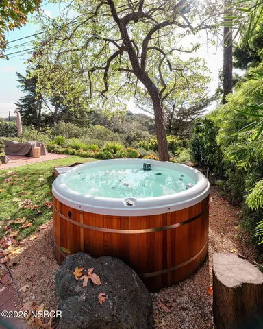 a close view of a vase of flowers sitting on a table