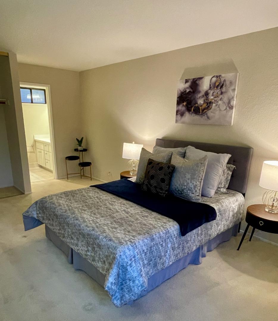 862 La Barbera Drive San Jose, CA 95126 - Photo 16 of 29 a bedroom with a bed and wooden floor