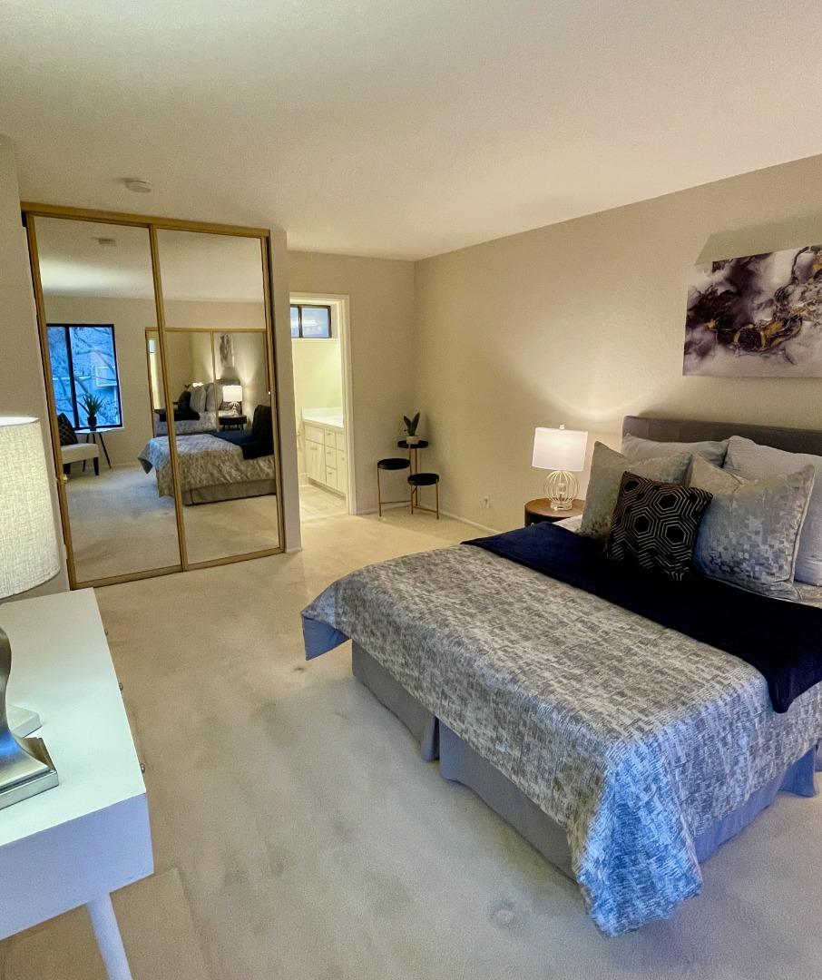 862 La Barbera Drive San Jose, CA 95126 - Photo 17 of 29 a bedroom with a large bed and a couch