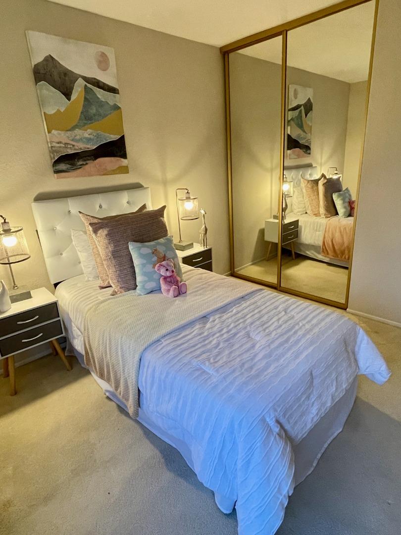 862 La Barbera Drive San Jose, CA 95126 - Photo 20 of 29 a bedroom with a bed and wooden floor