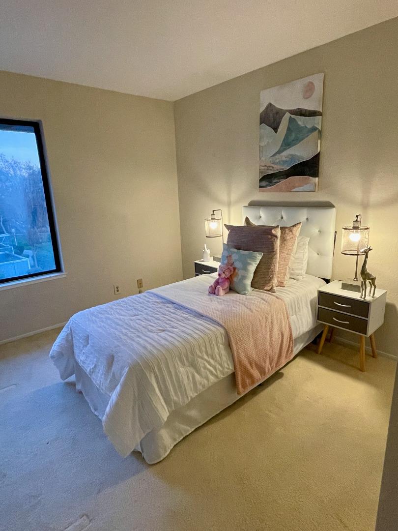 862 La Barbera Drive San Jose, CA 95126 - Photo 21 of 29 a bedroom with a bed and wall painting