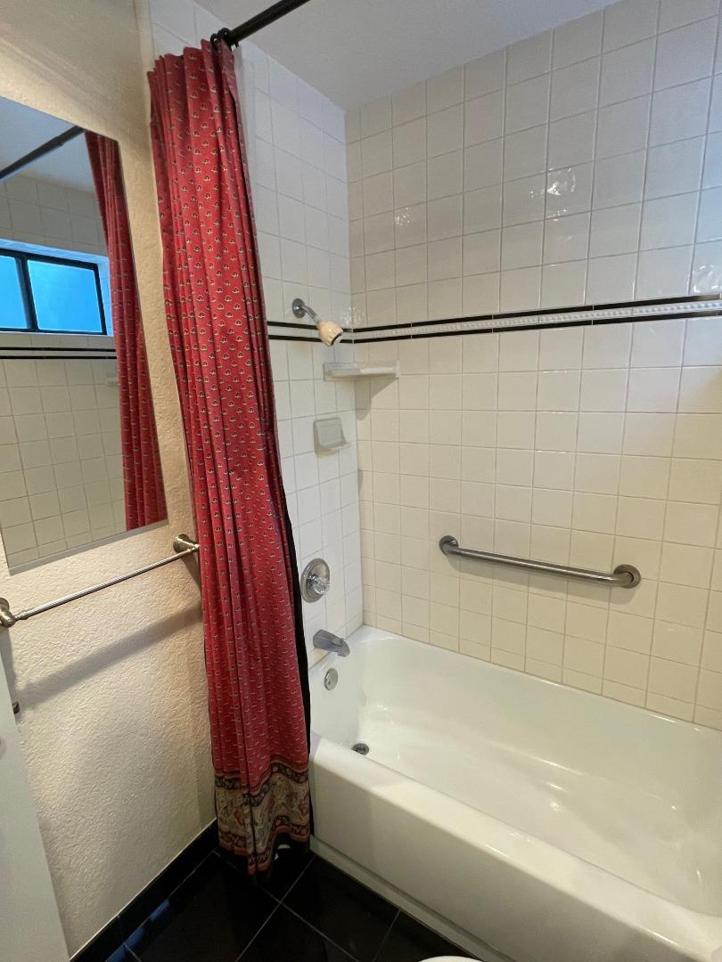 862 La Barbera Drive San Jose, CA 95126 - Photo 23 of 29 a bathroom with a bathtub and a shower